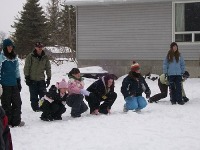 Photo of children playing games in the snow