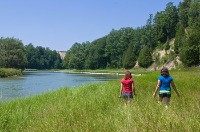Photo of children hiking by the water