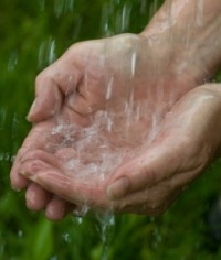 water dripping into hands photo