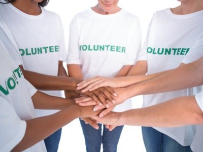 photo of volunteers stacking hands